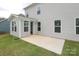 A concrete patio space extends off the back of the house and is lined with green grass at 1190 Sugar Creek Rd, Fort Mill, SC 29707