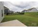 A large, grassy backyard bordered by black metal fencing surrounds a group of homes at 1190 Sugar Creek Rd, Fort Mill, SC 29707