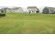 Expansive grassy backyard area between homes, offering plenty of space for outdoor activities at 1190 Sugar Creek Rd, Fort Mill, SC 29707