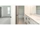 Bathroom features double sinks with white countertops and dark hardware, a tub and a window at 1190 Sugar Creek Rd, Fort Mill, SC 29707