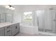 Well-lit bathroom offering a double vanity, soaking tub and a frameless glass shower at 1190 Sugar Creek Rd, Fort Mill, SC 29707