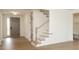 Welcoming entryway with hardwood floors, neutral color scheme, and a staircase nearby at 1190 Sugar Creek Rd, Fort Mill, SC 29707