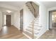 Inviting entryway with hardwood floors, staircase, and a modern, neutral color scheme at 1190 Sugar Creek Rd, Fort Mill, SC 29707