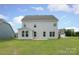 Rear exterior view shows siding, windows, and a concrete patio area with an open backyard at 1190 Sugar Creek Rd, Fort Mill, SC 29707