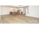 Bright kitchen with stainless appliances, island, and pendant lighting open to the living area at 1190 Sugar Creek Rd, Fort Mill, SC 29707