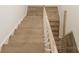 Stairway with light oak steps, white risers, and a light oak handrail at 1190 Sugar Creek Rd, Fort Mill, SC 29707