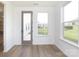 Bright sunroom with exterior door and view of the back yard and neighborhood at 1190 Sugar Creek Rd, Fort Mill, SC 29707