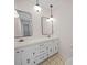 Bathroom with a double vanity, classic lighting, and neutral tile flooring at 1261 Westbrook Cir, Gastonia, NC 28052
