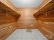 Walk-in cedar closet with shelving and tile flooring at 1261 Westbrook Cir, Gastonia, NC 28052