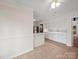 Bright dining area features tile flooring, white cabinetry, and access to kitchen and outdoors at 1261 Westbrook Cir, Gastonia, NC 28052
