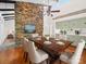 Elegant dining room featuring hardwood floors, a stone fireplace, and stylish chairs at 1261 Westbrook Cir, Gastonia, NC 28052