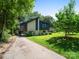 Exterior showcasing this multi-level home with a driveway, landscaping, and inviting facade at 1261 Westbrook Cir, Gastonia, NC 28052
