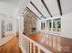 Expansive living room boasting hardwood floors and a striking stone fireplace at 1261 Westbrook Cir, Gastonia, NC 28052