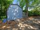 Backyard shed with painted siding providing extra outdoor storage space at 1261 Westbrook Cir, Gastonia, NC 28052
