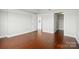 Bedroom with hardwood flooring, neutral walls, and easy access to a walk-in closet at 1315 East Blvd # 611, Charlotte, NC 28203