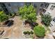 Overhead shot of courtyard's lush landscaping, benches, and geometric tiling between buildings at 1315 East Blvd # 611, Charlotte, NC 28203