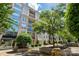 Stunning exterior view of the building with beautiful landscaping and benches for outdoor seating at 1315 East Blvd # 611, Charlotte, NC 28203