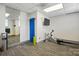This flex room features a mirror, TV, rowing machine, and yoga accessories at 1315 East Blvd # 611, Charlotte, NC 28203