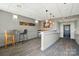 Inviting hallway with modern pendant lighting, ample space, and neutral décor at 1315 East Blvd # 611, Charlotte, NC 28203