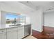 Modern kitchen featuring stainless steel appliances, quartz countertops, and an island with a sink at 1315 East Blvd # 611, Charlotte, NC 28203