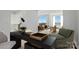 Bright living space with a desk area and balcony offering views and an open kitchen concept at 1315 East Blvd # 611, Charlotte, NC 28203