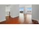 Open floor plan with beautiful wood floors, natural light, leading to balcony and kitchen at 1315 East Blvd # 611, Charlotte, NC 28203