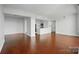 Open concept living area featuring wood floors, connecting living, dining, and kitchen spaces at 1315 East Blvd # 611, Charlotte, NC 28203