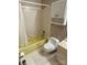 A simple bathroom features a standard tub with shower, white toilet, and a cabinet above toilet at 13427 Homewood Dr, Charlotte, NC 28262