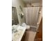 Bathroom featuring a shower with curtain, toilet, and vanity with single sink at 13427 Homewood Dr, Charlotte, NC 28262
