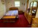 Cozy bedroom features a bed, a dresser with mirror, and wooden furniture at 13427 Homewood Dr, Charlotte, NC 28262