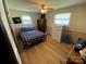 Bedroom featuring a bed with patterned bedding, a dresser, and a window for natural light at 13427 Homewood Dr, Charlotte, NC 28262