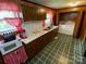 Well-lit kitchen with built-in appliances and abundant counter space at 13427 Homewood Dr, Charlotte, NC 28262