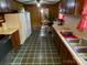 Functional kitchen features dark wood cabinets, ample counter space, and stainless sink at 13427 Homewood Dr, Charlotte, NC 28262