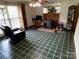 Inviting living room offers tile floors and a brick fireplace for a cozy atmosphere at 13427 Homewood Dr, Charlotte, NC 28262