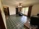 Cozy living room boasts checkered tile flooring and natural light at 13427 Homewood Dr, Charlotte, NC 28262