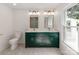 Modern bathroom featuring double vanity, dual mirrors, and sleek fixtures and lighting at 138 Shepherd Rd, Mooresville, NC 28115