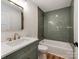 Modern bathroom showcases a tub, tile surround, marble countertop, and stylish fixtures at 138 Shepherd Rd, Mooresville, NC 28115