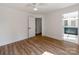 Bright bedroom featuring hardwood floors and view into an en-suite bathroom at 138 Shepherd Rd, Mooresville, NC 28115