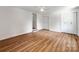 Spacious bedroom with hardwood floors, white walls, and access to a bathroom and closet at 138 Shepherd Rd, Mooresville, NC 28115