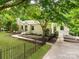 Charming single-story home with a well-manicured lawn and beautiful landscaping and a fenced yard at 138 Shepherd Rd, Mooresville, NC 28115
