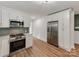 A well-equipped kitchen includes stainless steel appliances, white cabinets, and plenty of storage space at 138 Shepherd Rd, Mooresville, NC 28115