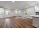 Bright and airy living room with wood floors, white walls, and large windows at 138 Shepherd Rd, Mooresville, NC 28115