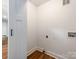 Unfinished room with hardwood floors and hookups for a washer and dryer unit at 138 Shepherd Rd, Mooresville, NC 28115