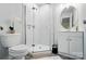 Modern bathroom featuring a glass-enclosed shower, sleek fixtures, and ample vanity space at 13821 David St, Huntersville, NC 28078