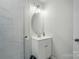 Bathroom features a glass-enclosed shower, modern vanity, and ample lighting at 13821 David St, Huntersville, NC 28078