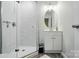 A clean bathroom featuring a glass shower and modern vanity at 13821 David St, Huntersville, NC 28078
