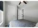 Bedroom interior featuring a ceiling fan, a large storage closet and a view into a kitchen at 13821 David St, Huntersville, NC 28078