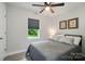Cozy bedroom with natural light and neutral decor, creating a relaxing atmosphere at 13821 David St, Huntersville, NC 28078