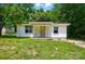 Charming home featuring a covered front porch, white siding, and well-maintained landscaping at 13821 David St, Huntersville, NC 28078