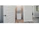 Efficient laundry area with stacked washer and dryer, maximizing space and convenience at 13821 David St, Huntersville, NC 28078